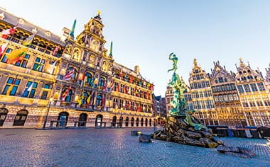 Brabo Fountain illuminated in the evening, Antwerp, Belgium